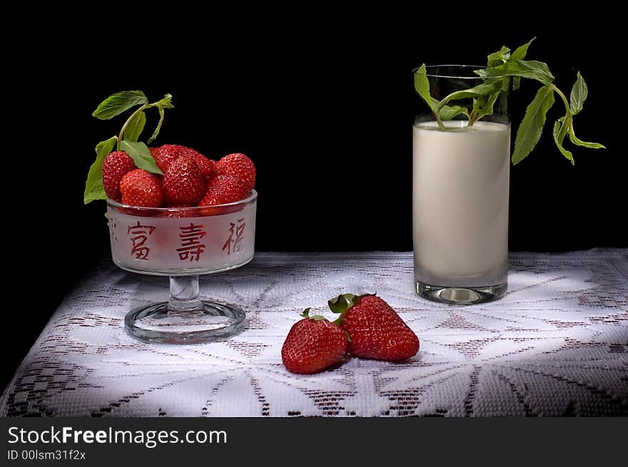 Tasty red strawberry with mint and milk. Tasty red strawberry with mint and milk