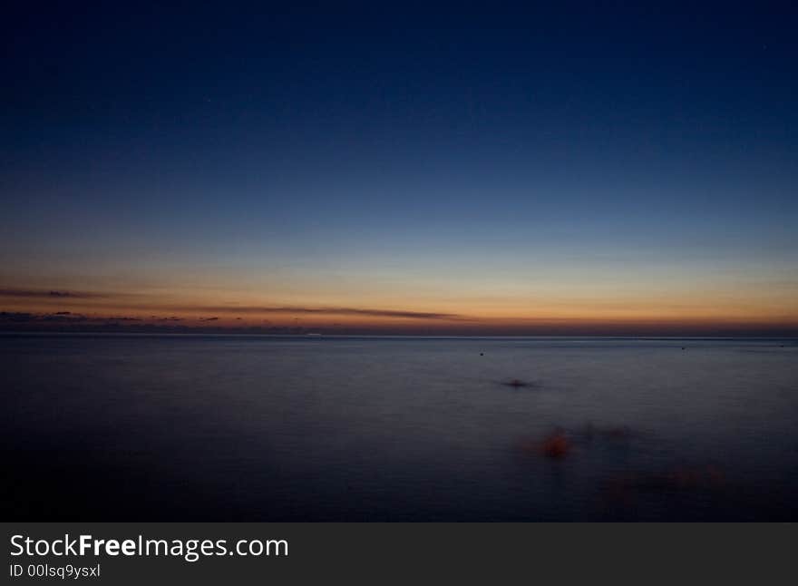 Sunset in the silent evening on seacoast