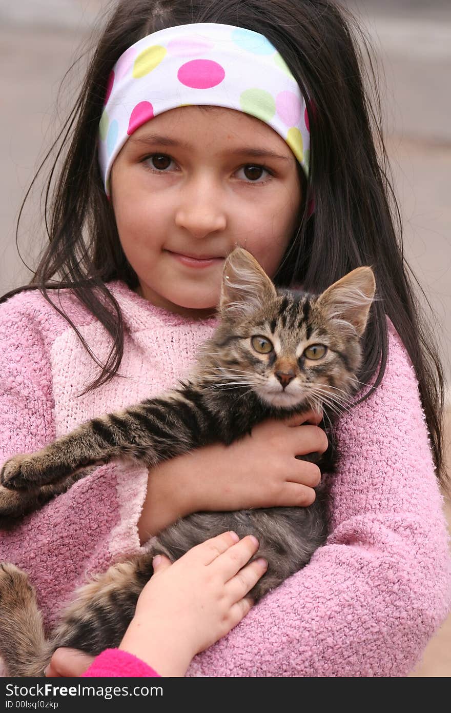 The nice girl with a kitten on hands