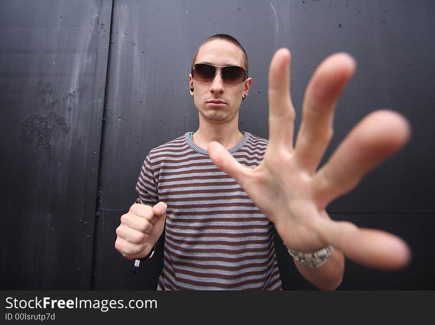 Wide-angle shot to give give big hands to a young man. Wide-angle shot to give give big hands to a young man