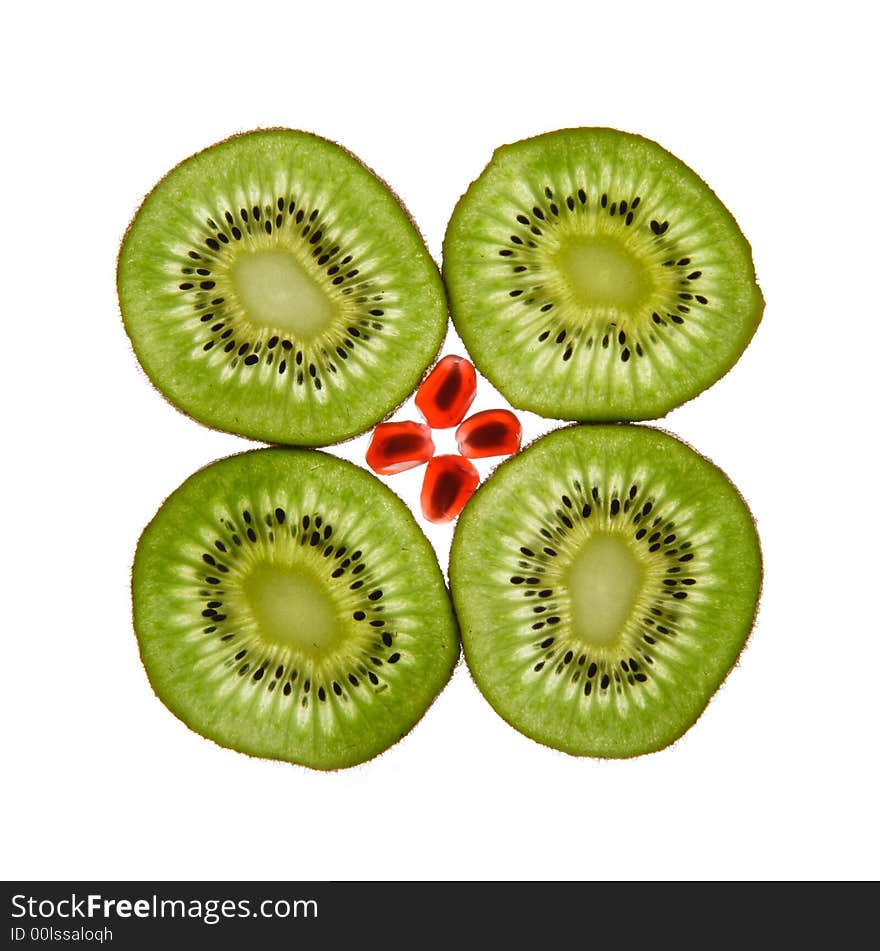 Four kiwis and pomegranate on a white background