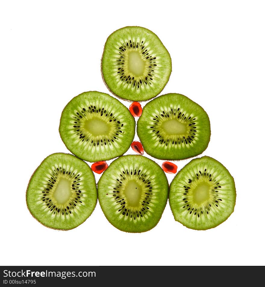 Six kiwis and pomegranate on a white background