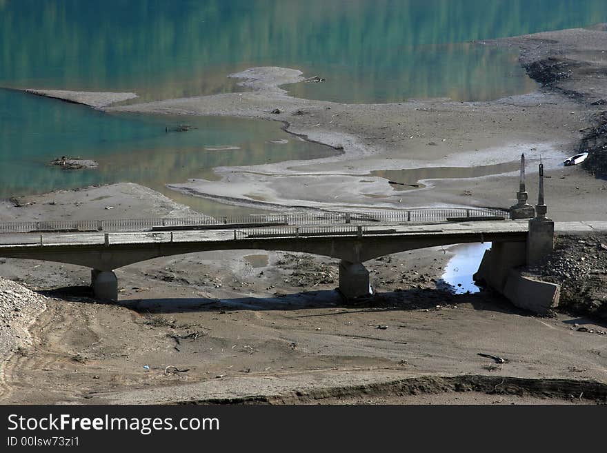 Bridge on the blue lake in Caucasus