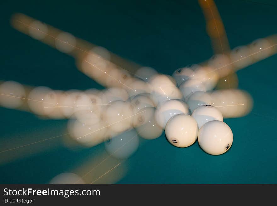 Billiard balls scattering in the different sides after impact. Billiard balls scattering in the different sides after impact.