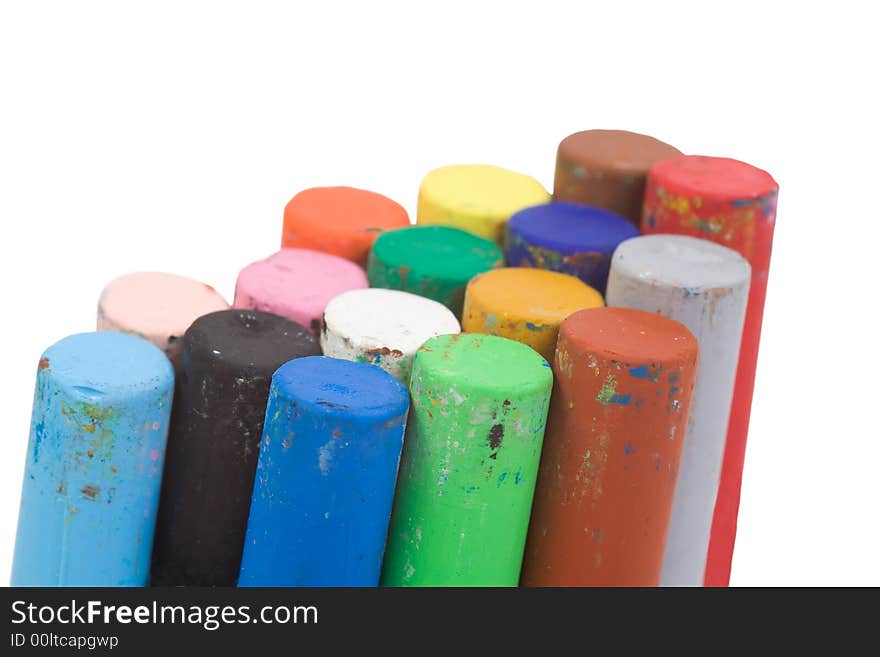 Stacked together isolated pastel crayons