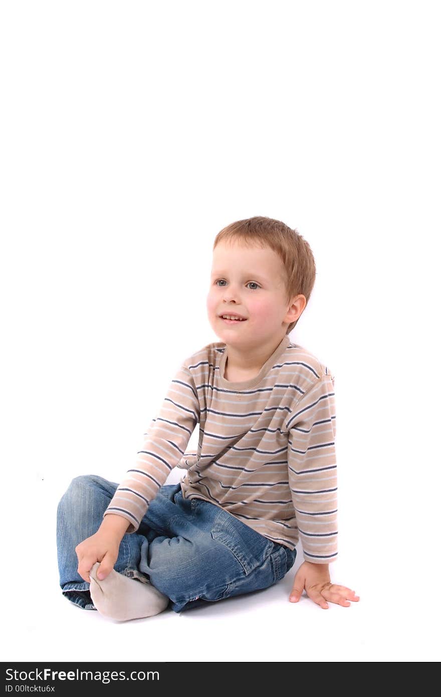 Portrait of very nice young boy on the white background