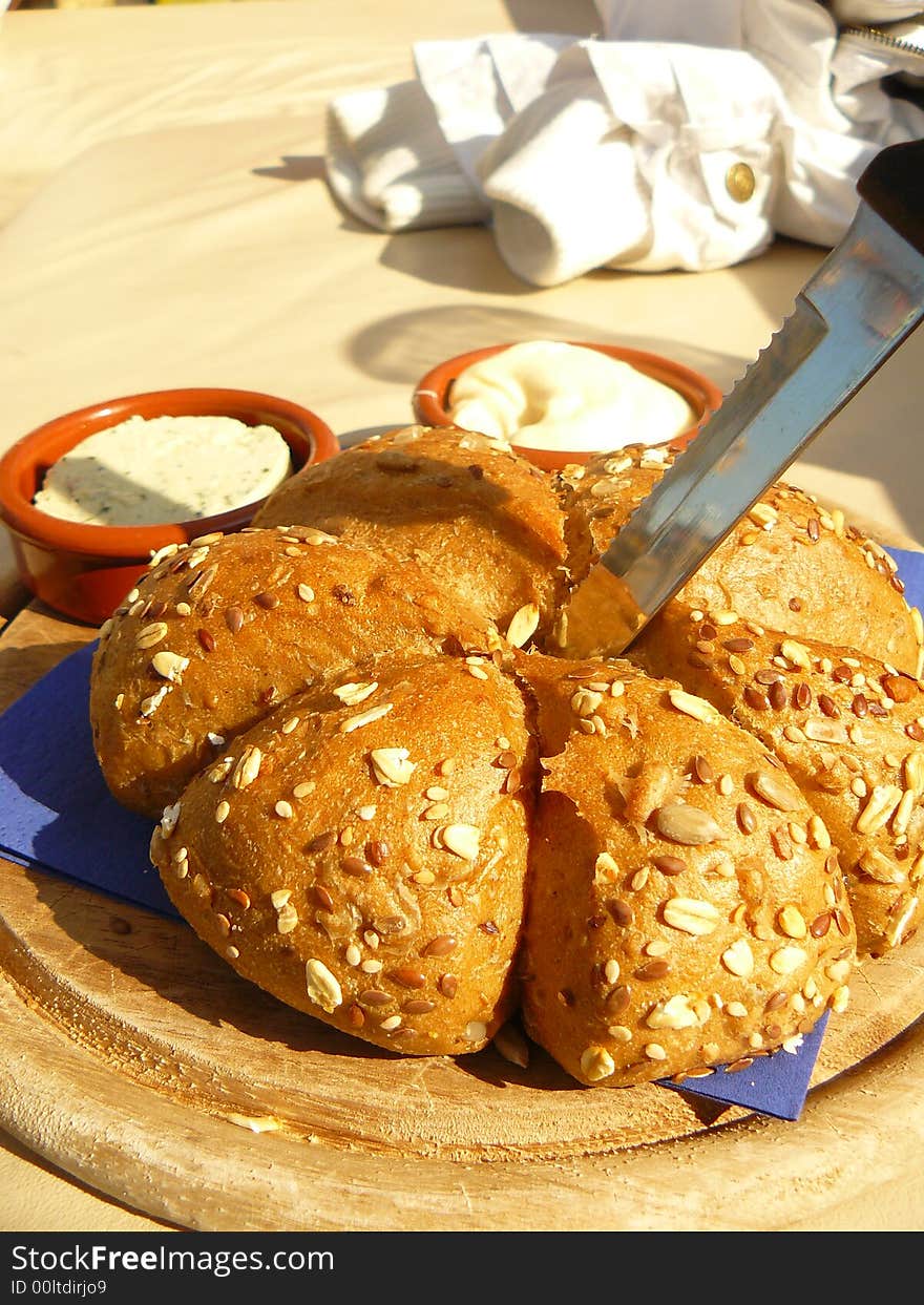 A bread on with a knife in it. A bread on with a knife in it