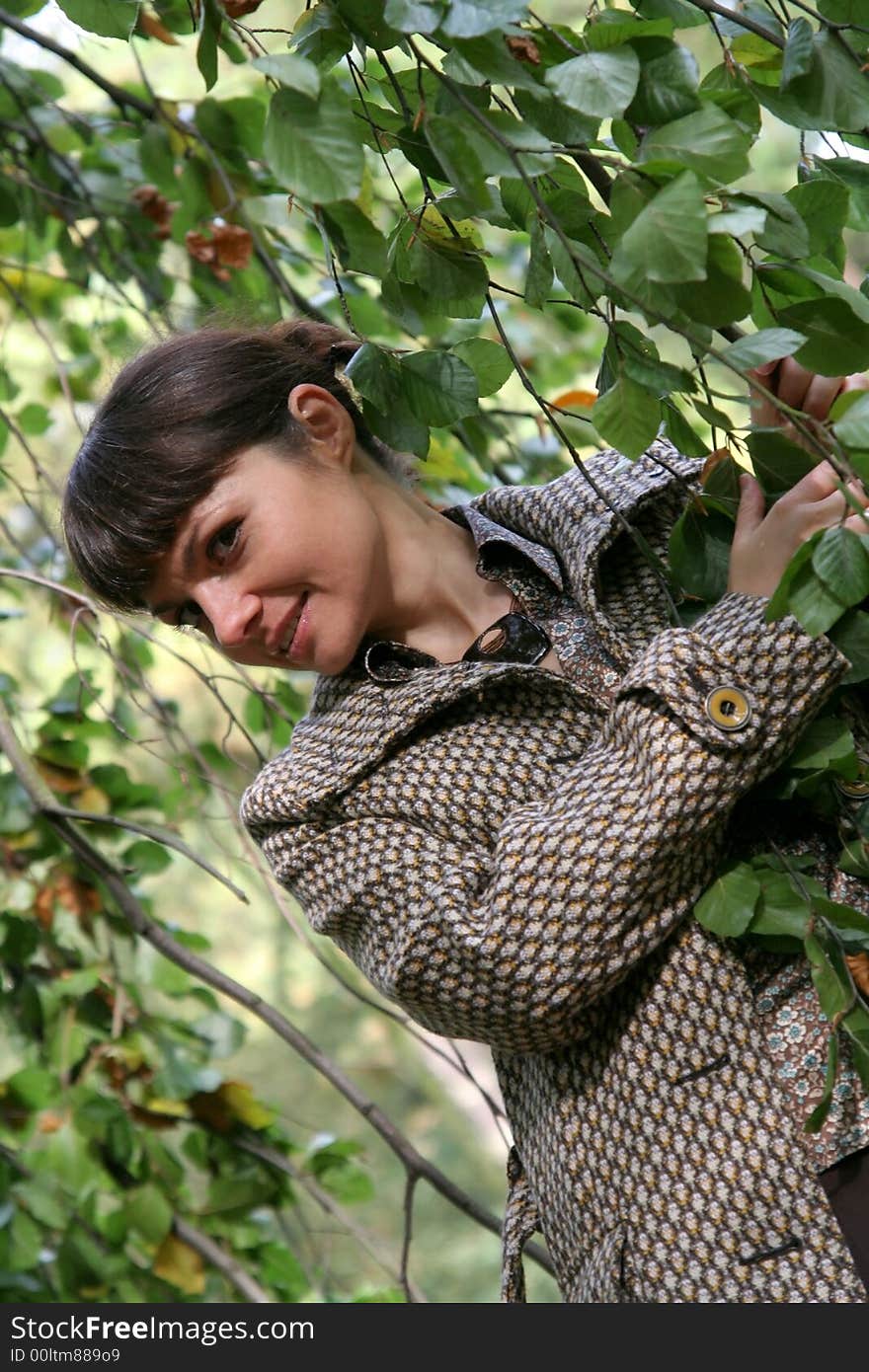 Beautiful woman walking in the autumn park. Beautiful woman walking in the autumn park