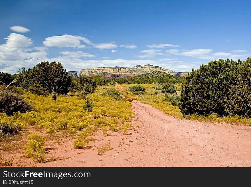 A road leading to the mountains of sedona. A road leading to the mountains of sedona