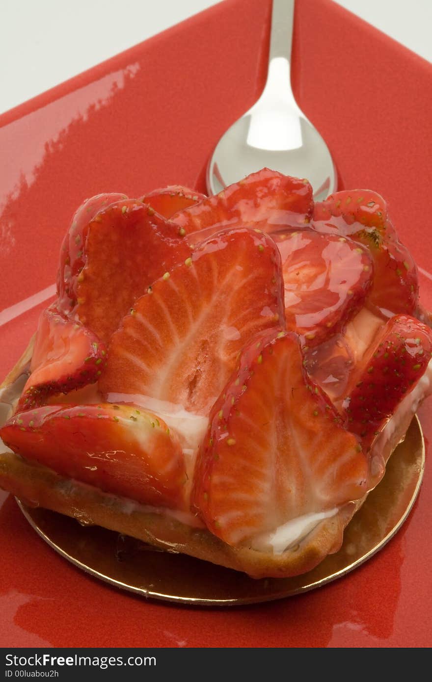 Strawberry cake dessert on a red plate