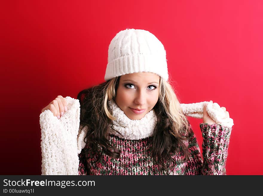 Winter portrait of a beautiful young woman with a cap and a scarf. Winter portrait of a beautiful young woman with a cap and a scarf