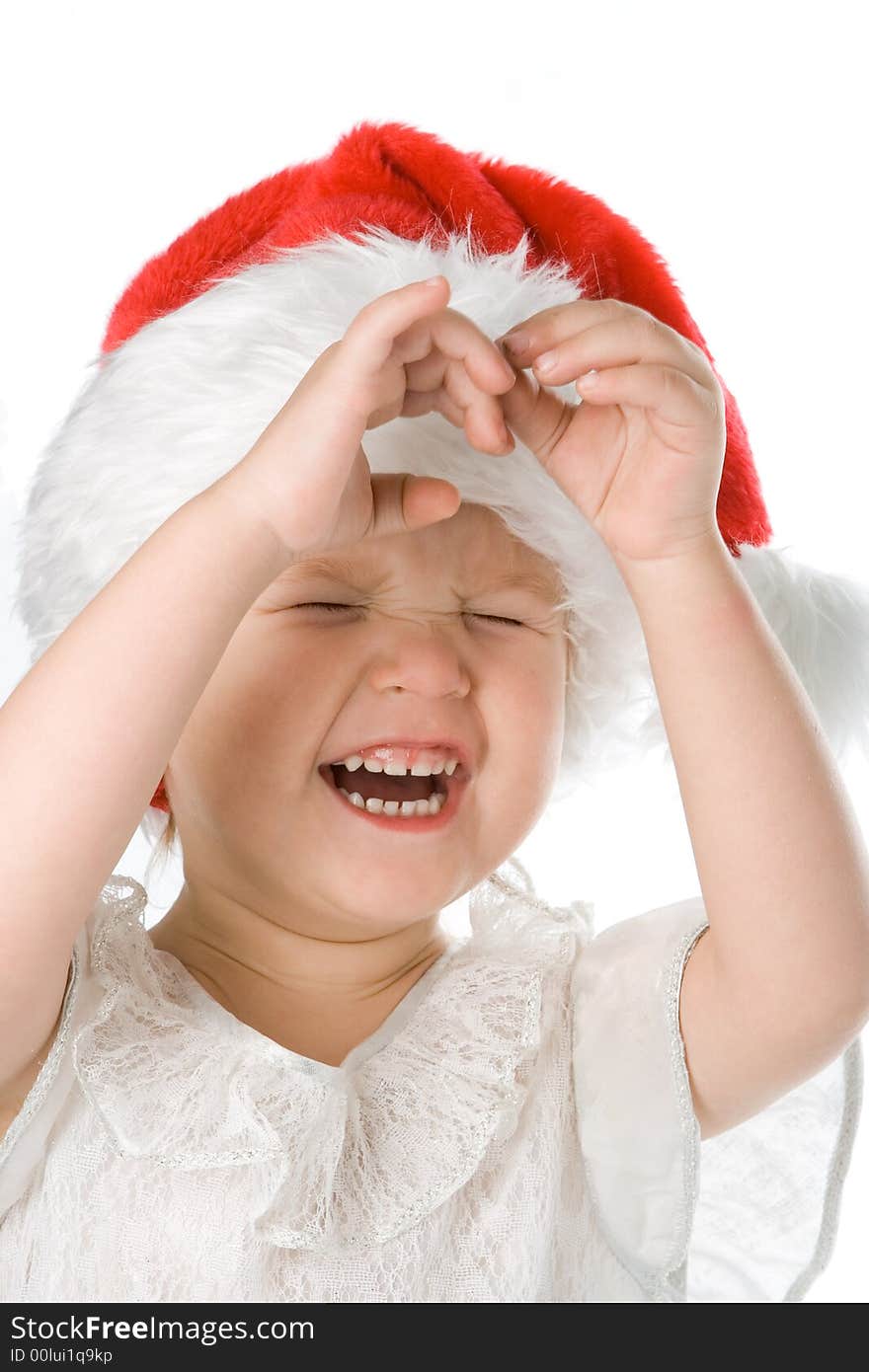 Pretty baby in santa claus christmas red hat over white background. Pretty baby in santa claus christmas red hat over white background