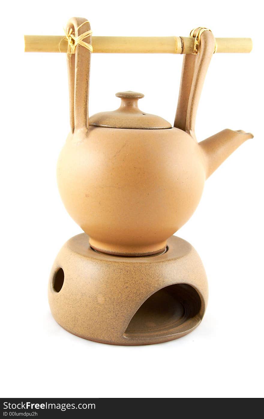 A teapot with heating from a candle, for green tea.