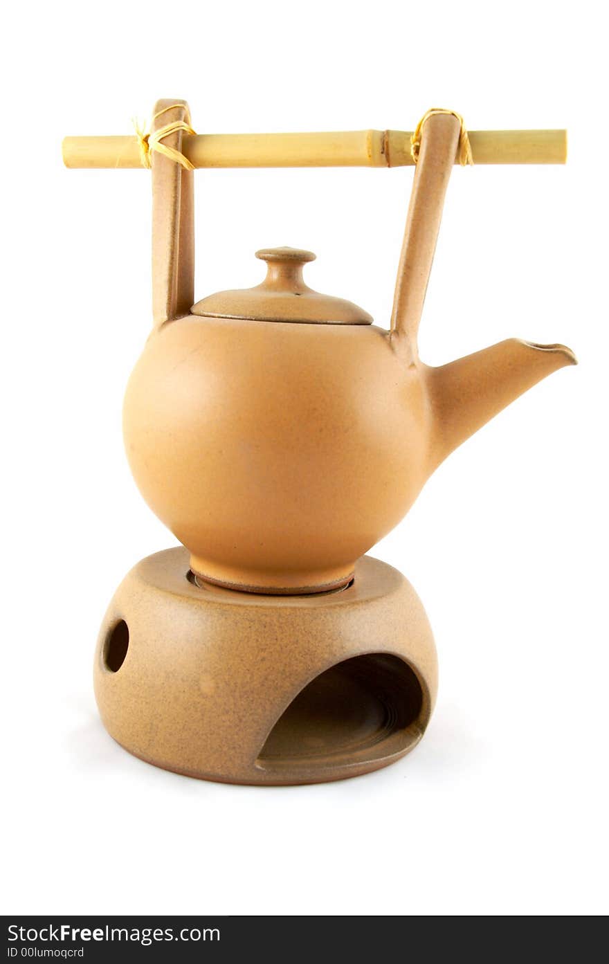 A teapot with heating from a candle, for green tea.