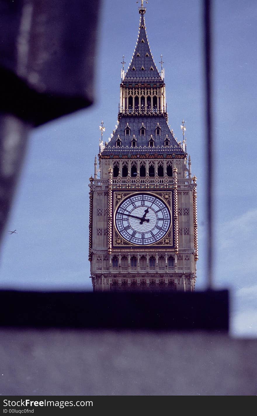 Palace of Westminster Clock Tower through Churchill Statue. Palace of Westminster Clock Tower through Churchill Statue