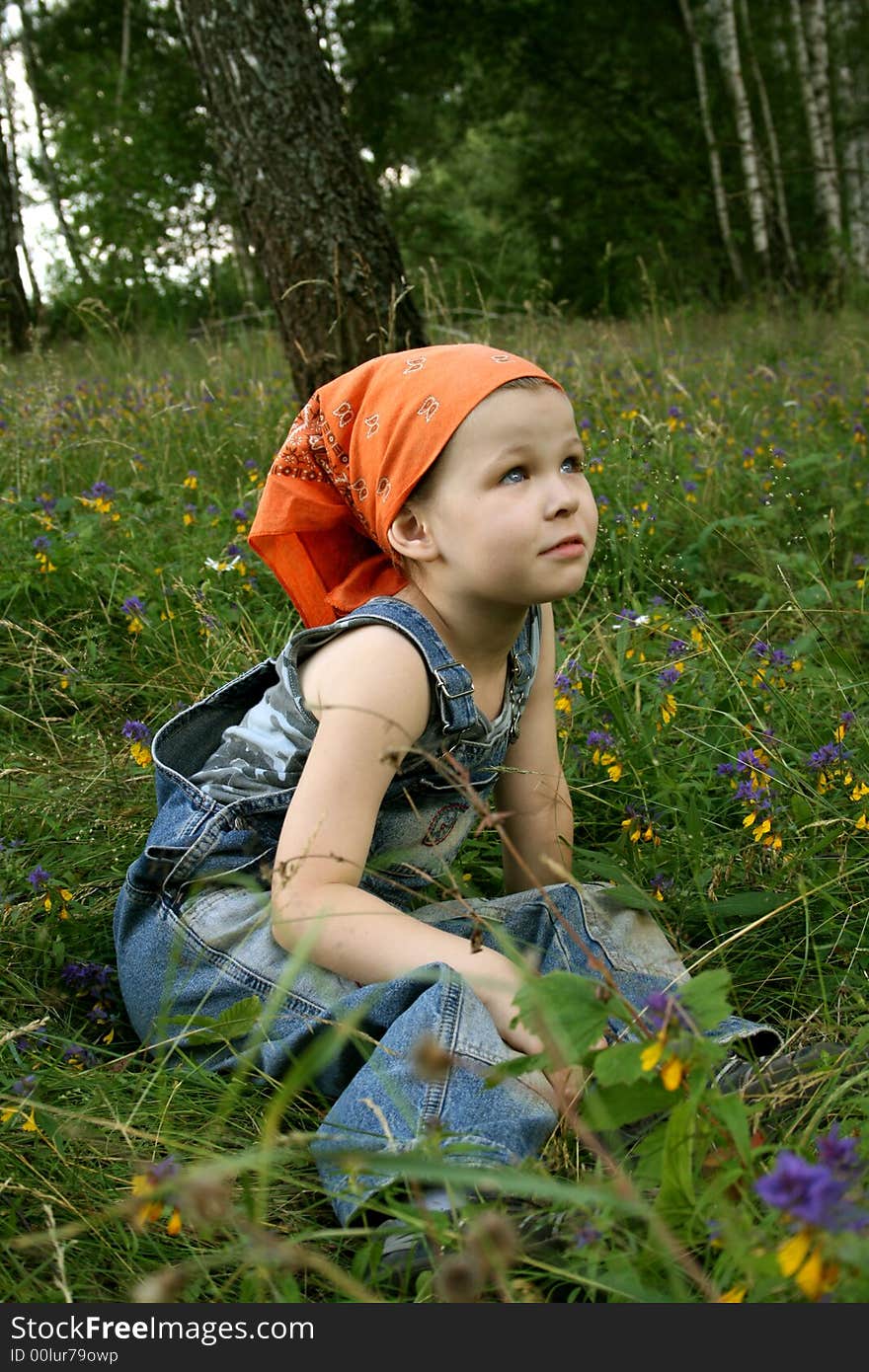 Little girl sit on grass in forest. Little girl sit on grass in forest