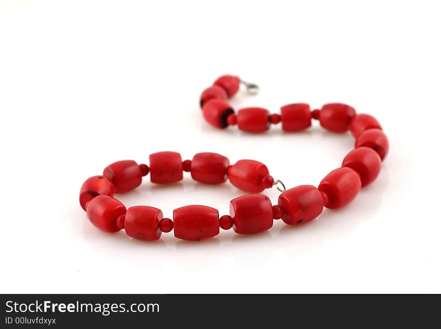 Red beads on white background