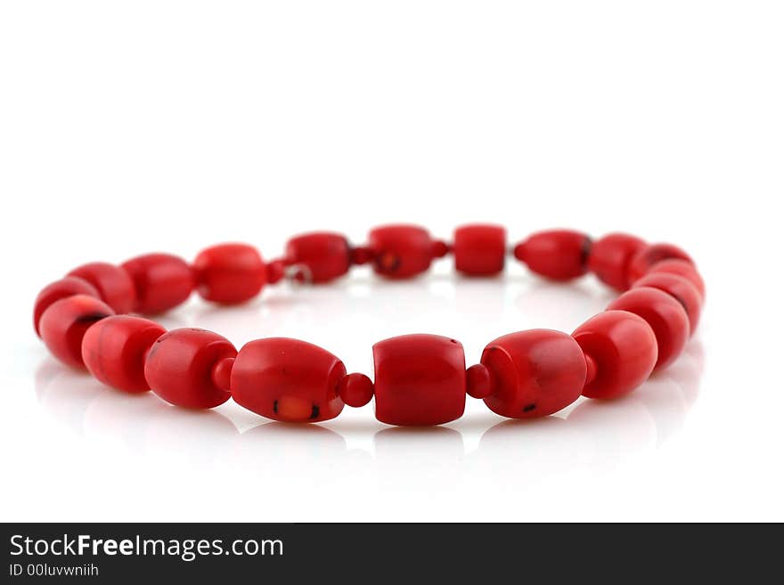 Red beads on white background