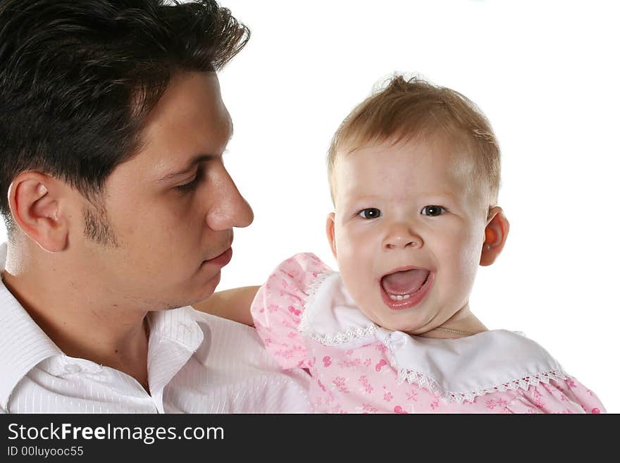 The happy young family with the small child looks forward. The happy young family with the small child looks forward