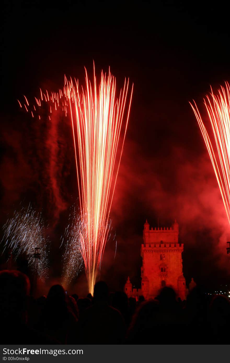 New year fireworks in the night in lisbon near tower belem, portugal