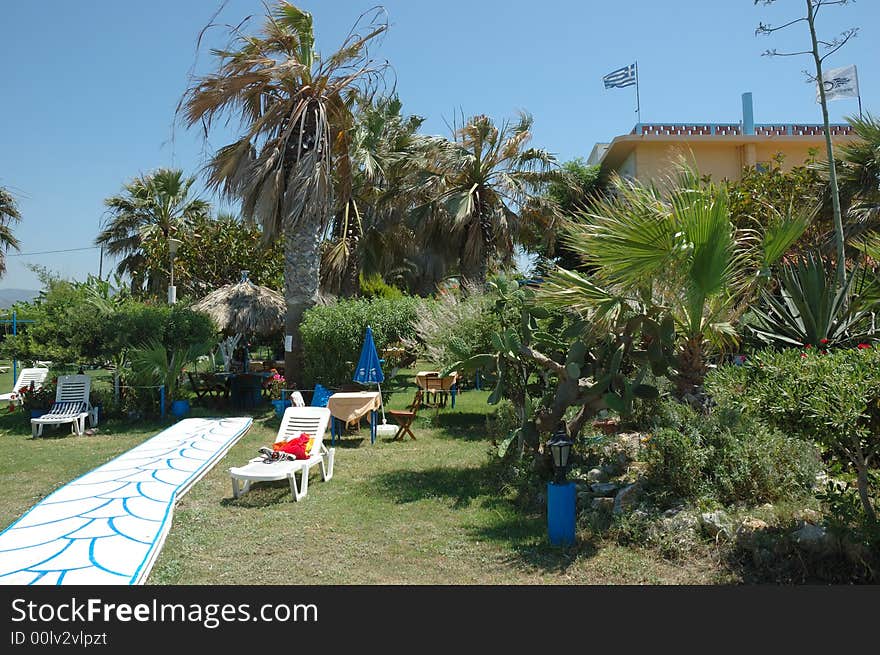 Garden of a small greek hotel; sunny day. Garden of a small greek hotel; sunny day