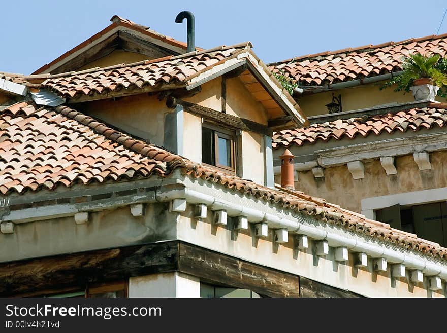 Roof and upper floor of an old historical building in Portogruaro, Italy