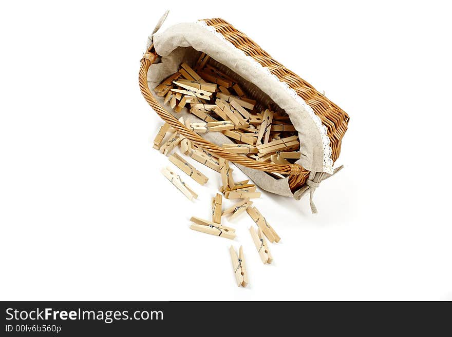 Old fashioned laundry basket with clothespins