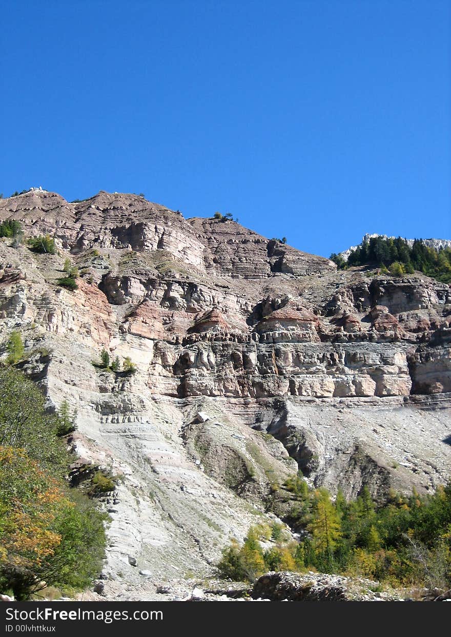 Hillside in the mountains in nature with rocks grass and other plants. Hillside in the mountains in nature with rocks grass and other plants