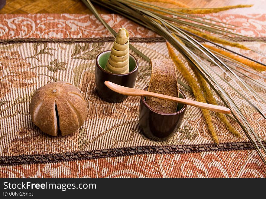 Showing a dried leaves tangering orange petals and wooden spoon. Showing a dried leaves tangering orange petals and wooden spoon.