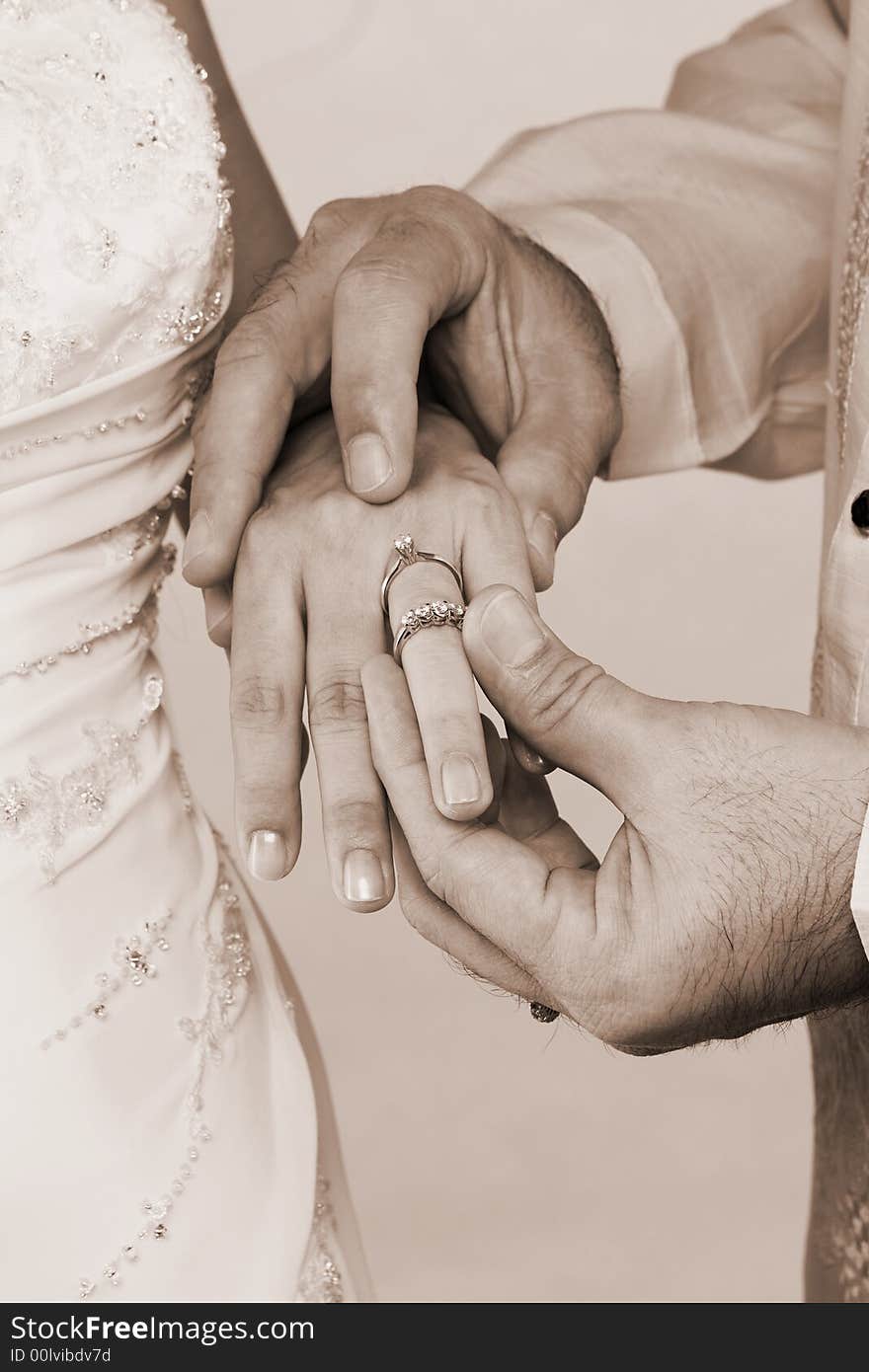 Couple wearing wedding to each other. Couple wearing wedding to each other