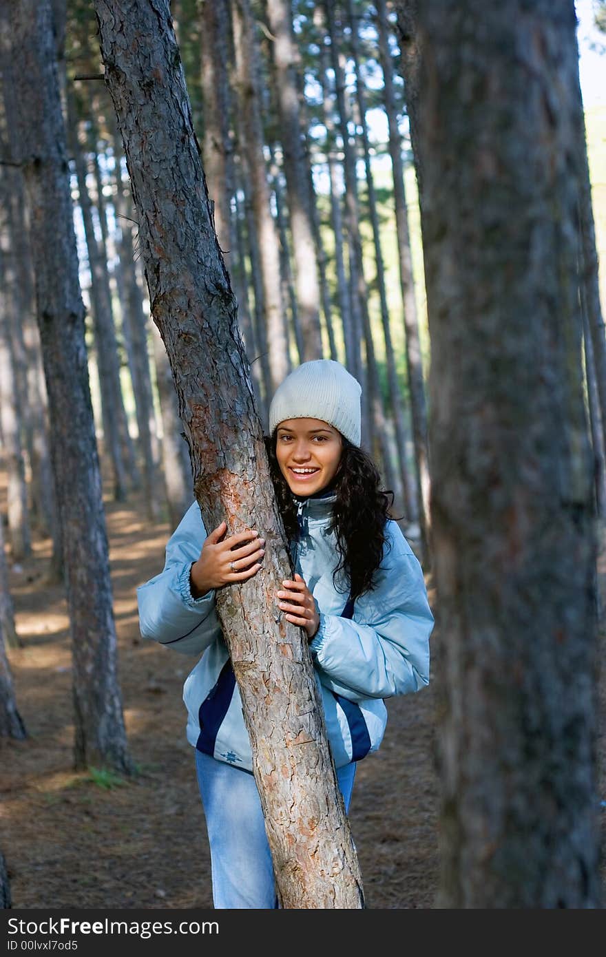 Beautiful winter girl in blue jacket