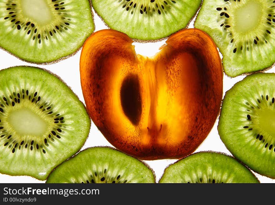 Kiwi and persimmon on a white background