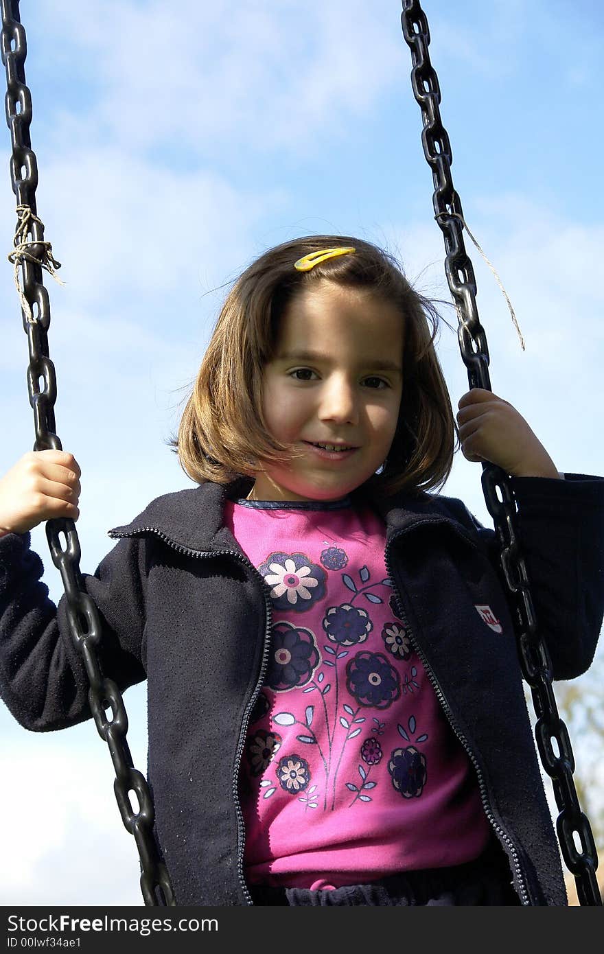 Little girl being playing on grass field. Little girl being playing on grass field