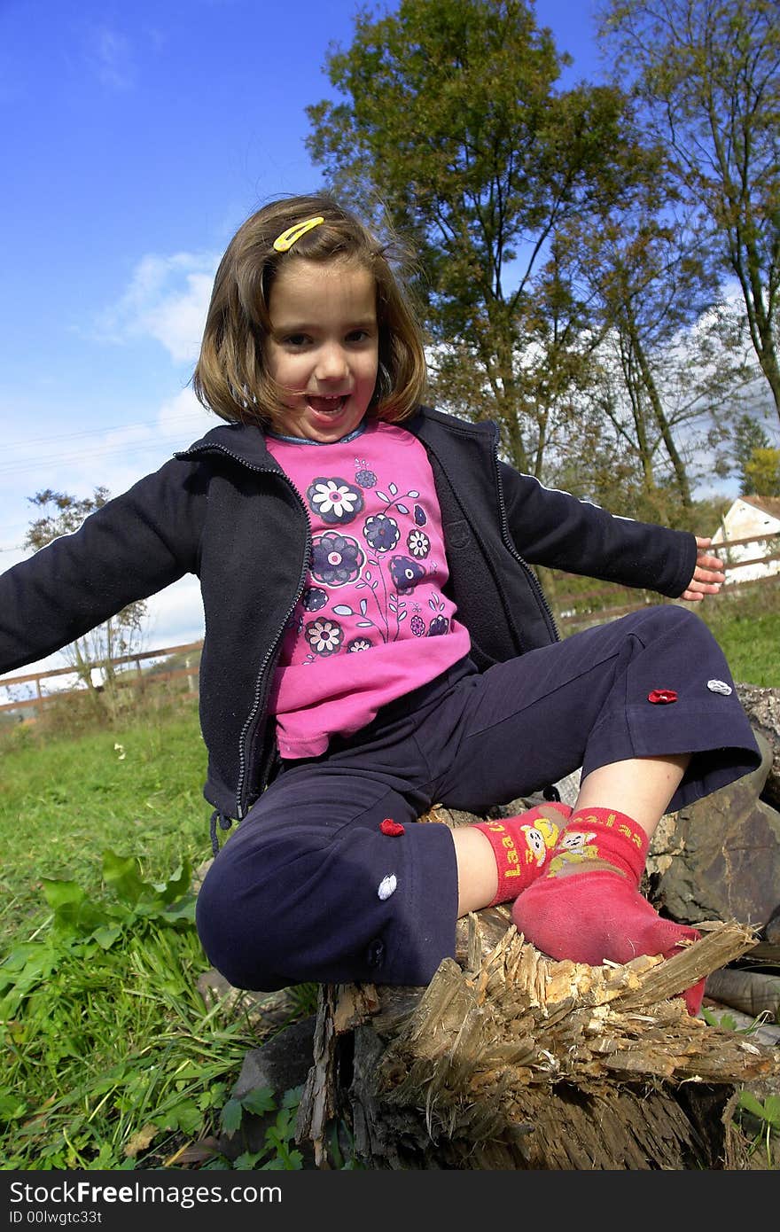 Little girl being silly on grass field. Little girl being silly on grass field