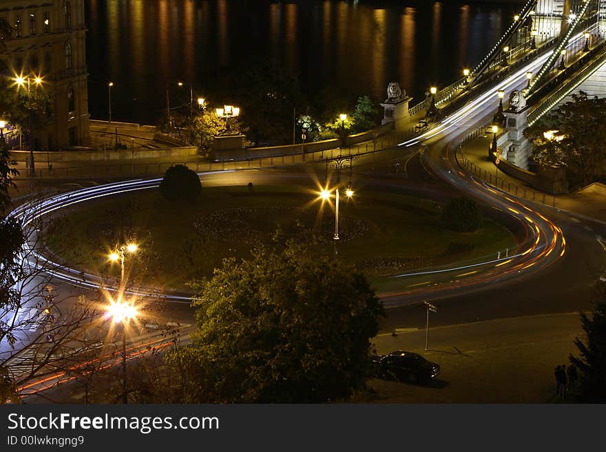 Night circle car light in my city. Circle center park. Background the chain bridge. Night circle car light in my city. Circle center park. Background the chain bridge.