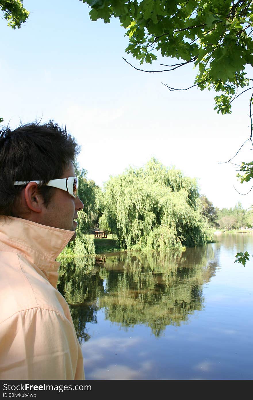 Male model against a background of water with reflections