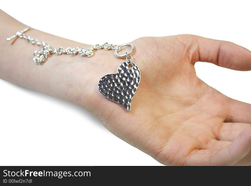 Isolated hand and silver heart. Isolated hand and silver heart