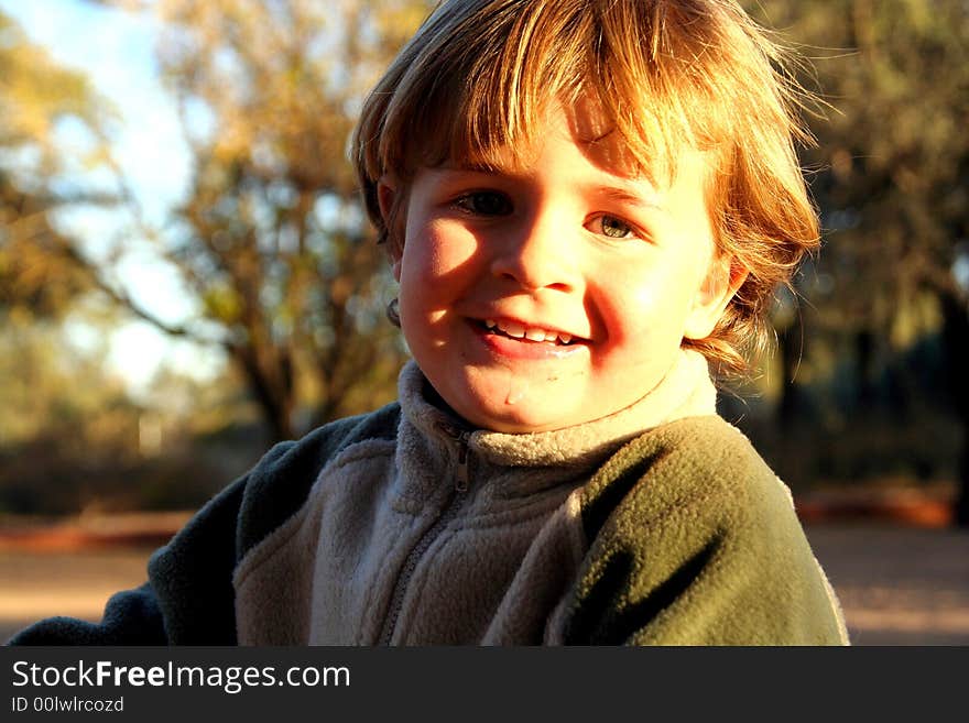 Portrait of a little boy playing outdoors. Portrait of a little boy playing outdoors