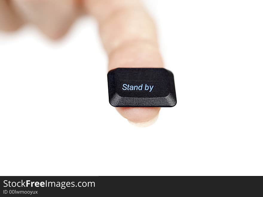 Finger holding the stand by key, on white background