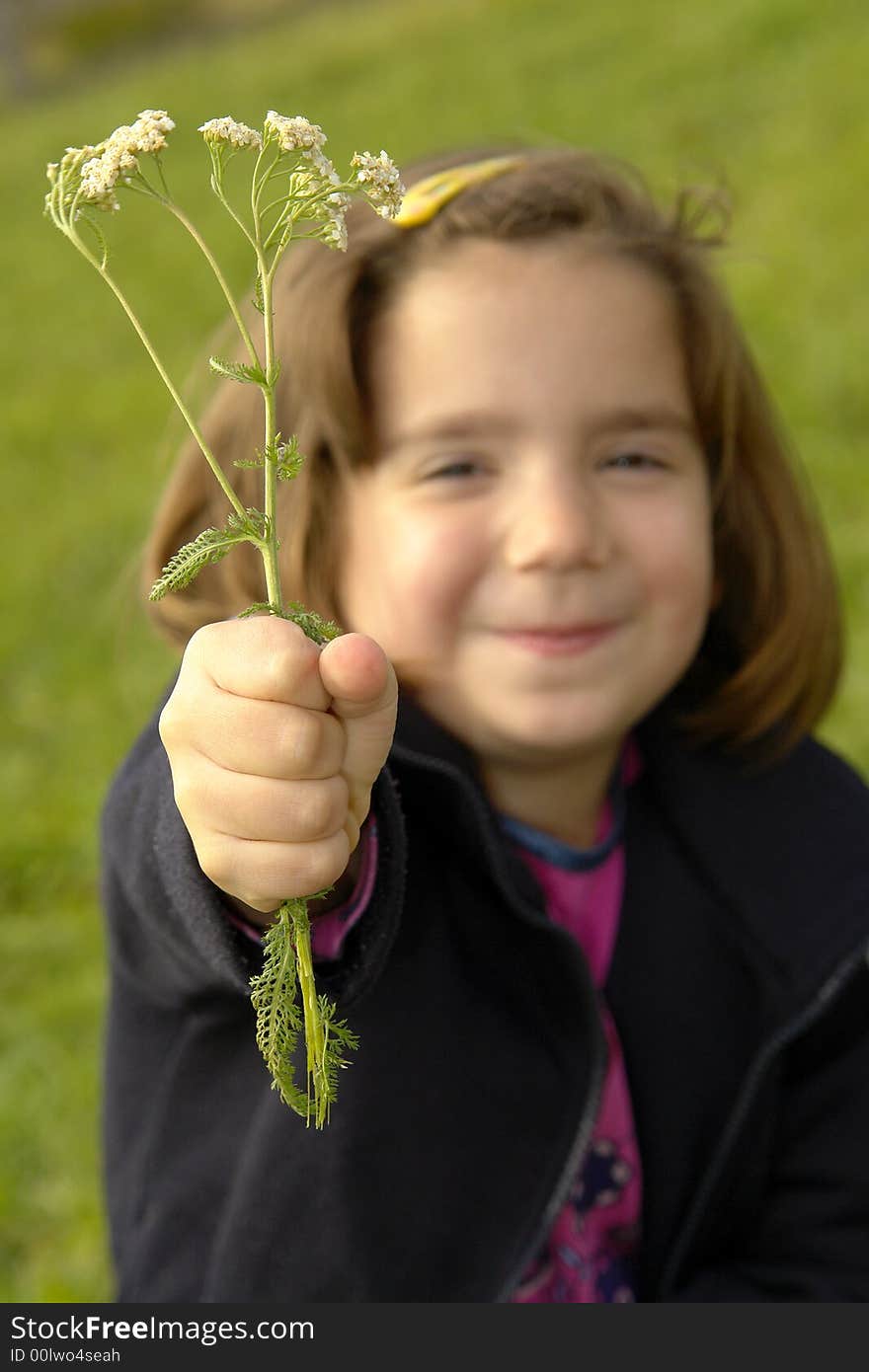 Little girl being silly on grass field. Little girl being silly on grass field