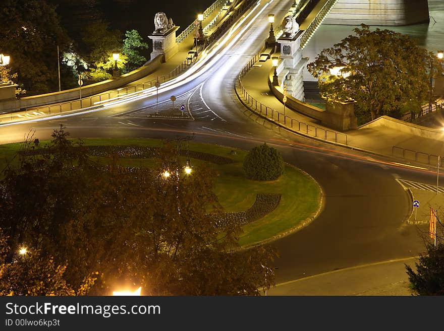 Night circle car light in Budapest. Circle center park. Background the chain bridge. Night circle car light in Budapest. Circle center park. Background the chain bridge.