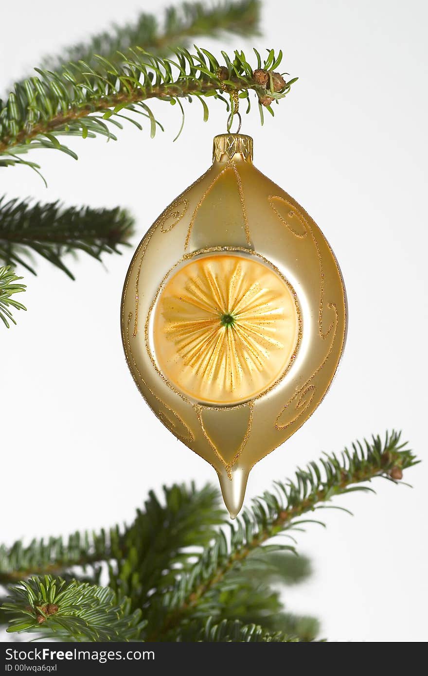 Yellow glass ball on tree