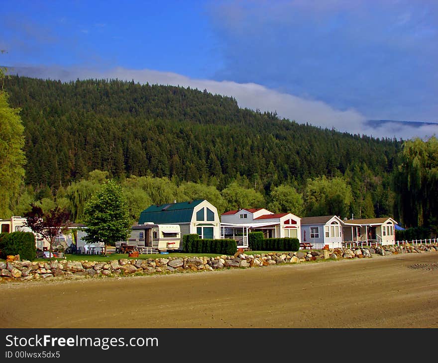 A view of the waterfront homes at Mara Lake, BC, Canada. This lake is located between Sicamous and Salmon Arm in the Okanagan - North Shuswap Region in British Columbia, Canada. A view of the waterfront homes at Mara Lake, BC, Canada. This lake is located between Sicamous and Salmon Arm in the Okanagan - North Shuswap Region in British Columbia, Canada.