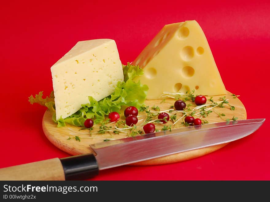 Piece of cheese on a red background