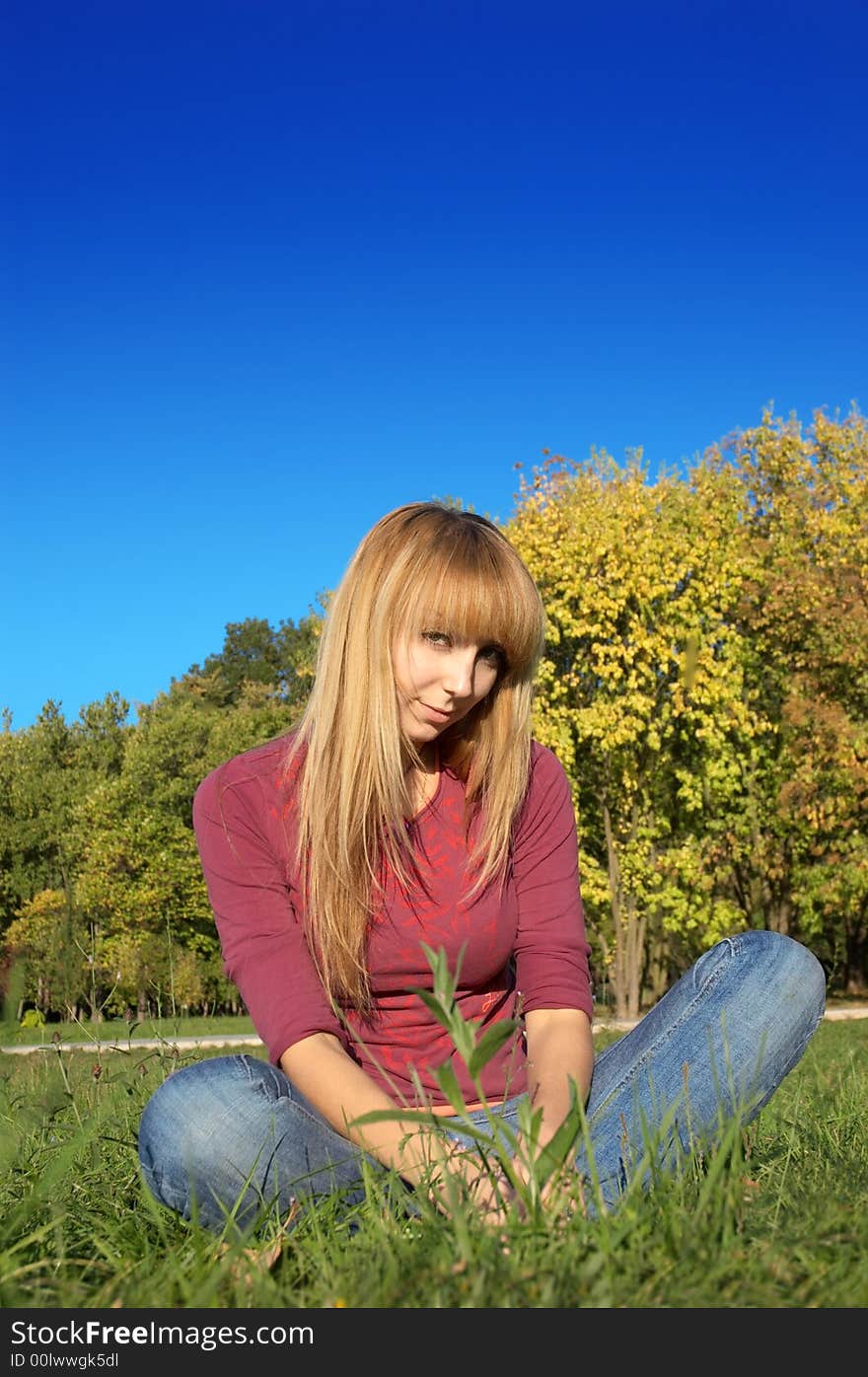 Blond Relaxing On The Grass