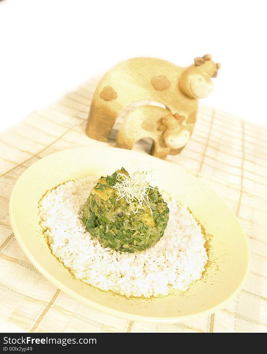 Spinach dish served with white rice