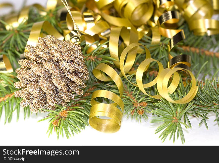 Decorative pine cone with gold ribbon