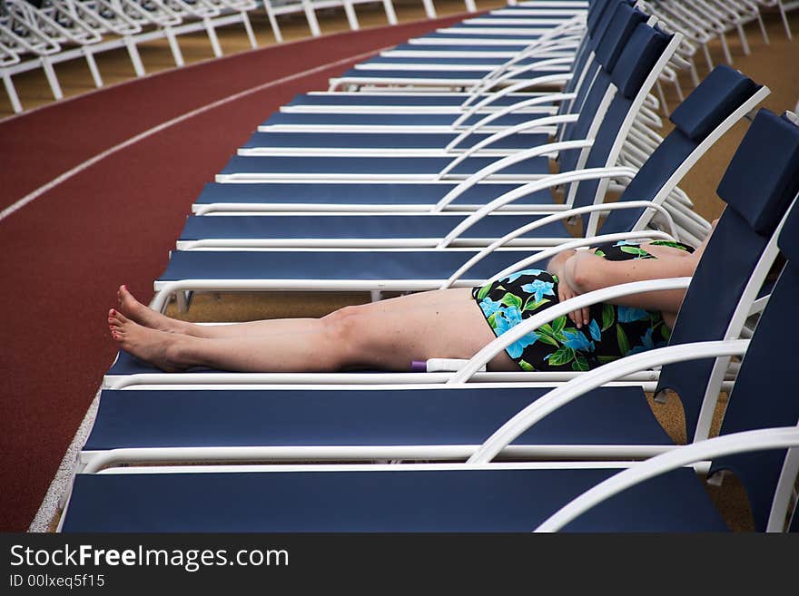 Woman taking the sun aboard of a ship. Woman taking the sun aboard of a ship