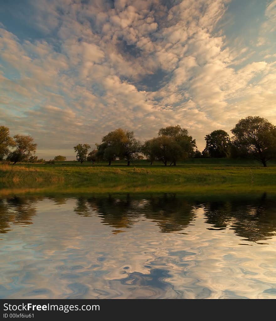 Summer meadow and river