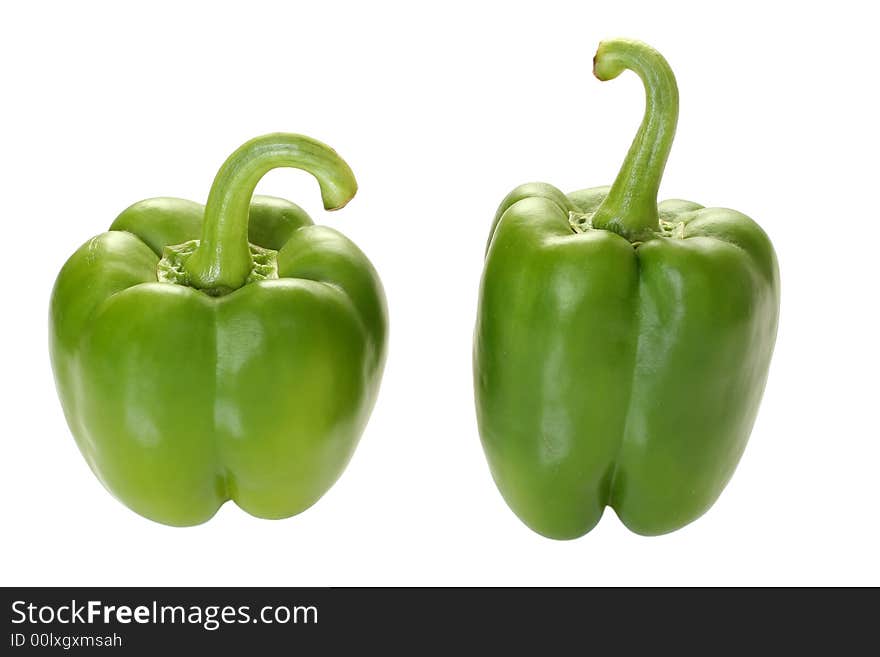 Two green pepper on white